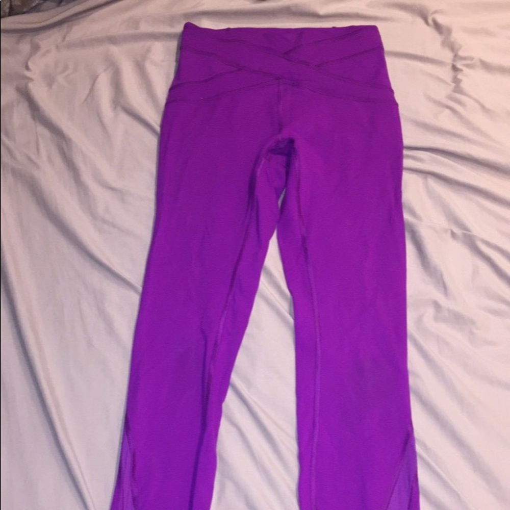 Fuchsia Lululemon leggings with mesh detail.